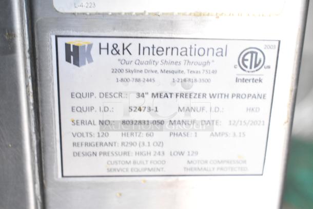 H&K International 34" meat freezer label, propane-powered, serial 8032831-050, manufactured 12/15/2021, 120V, 3.15A.