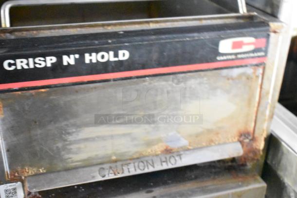 Carter-Hoffmann Crisp N' Hold food warmer, metal exterior, visible wear, "Caution Hot" marking, suitable for restaurant use.