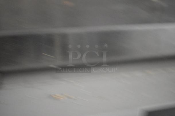 Blurry image obscuring details; unable to identify item features or condition.