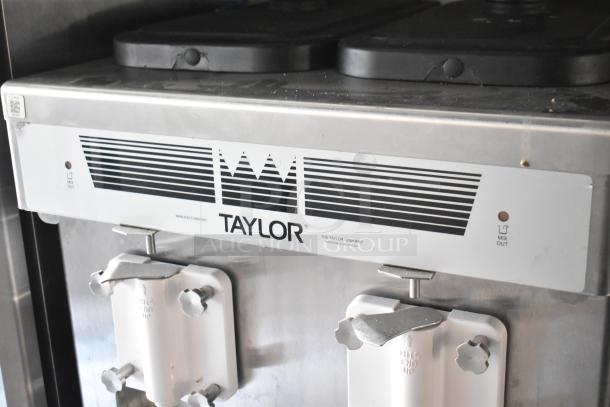 Taylor ice cream machine, stainless steel with dual dispensers, Taylor logo label, used condition. Model visible: LT MIX OUT.