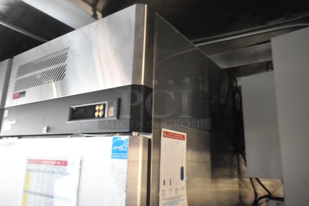 Stainless steel commercial refrigerator with digital controls, Energy Star label, in good condition, visible venting.