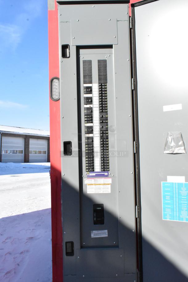 Electrical panel of 28' Wendy's fast food trailer, showing multiple circuit breakers and labels. Panel part of fully outfitted mobile kitchen.