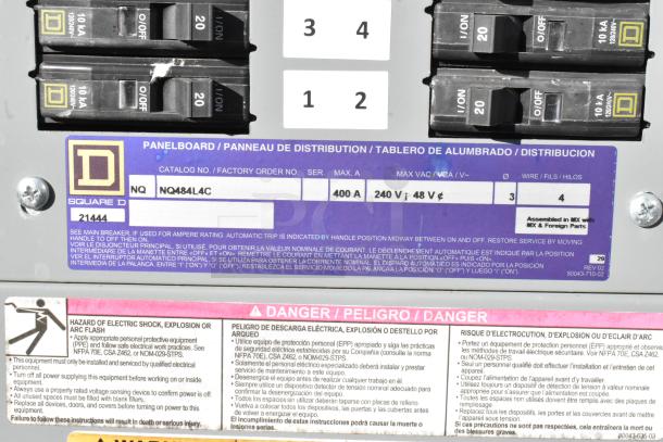 Square D panelboard with breaker switches, labeled NQ484L4C, 400A, 240V. Safety warnings visible.