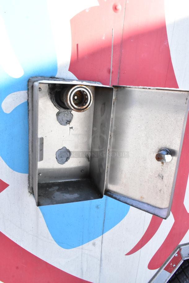 Electrics on Wendy's 28' fast food trailer. Open metal panel exposing connection point. Part of fully equipped mobile kitchen.