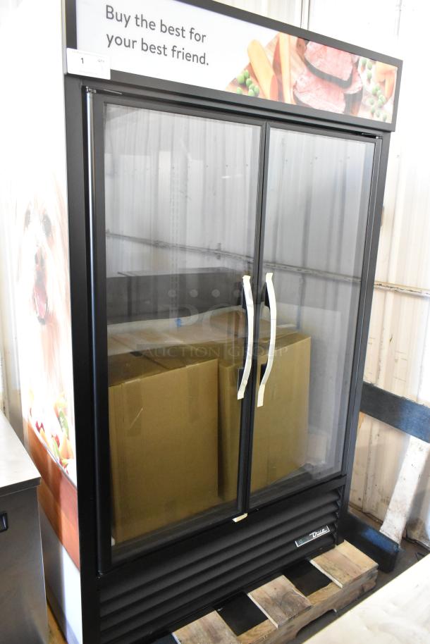 Brand new 2025 True TVM-48SL-HC metal 2-door reach-in cooler, 115V, minor scratches, commercial use, on wooden pallet.