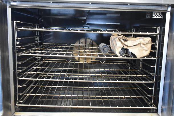 Southbend PCE75S/SD stainless steel convection oven with view doors, metal racks, and thermostatic controls. Mint condition.