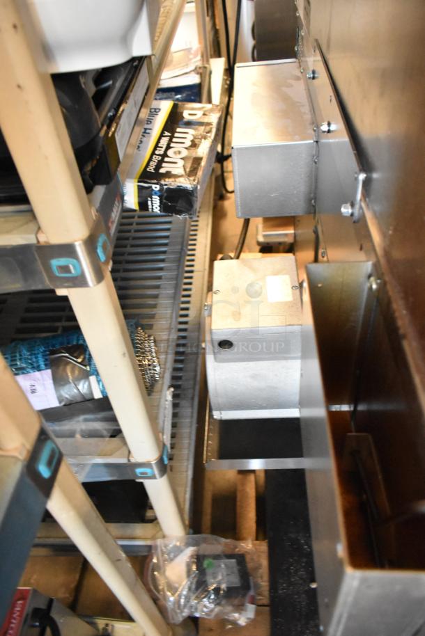 Stainless steel components of a Southbend PCE75S/SD convection oven, featuring thermostatic controls and metal racks.