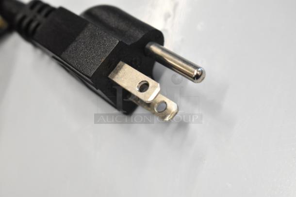 Close-up of a black electrical plug, showing three prongs, for Avantco 194MCF430A ice machine.