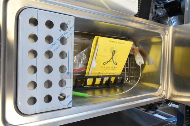 Brand new Arcobaleno APCG35H stainless steel pasta cooker interior, including owner's manual and packaging.