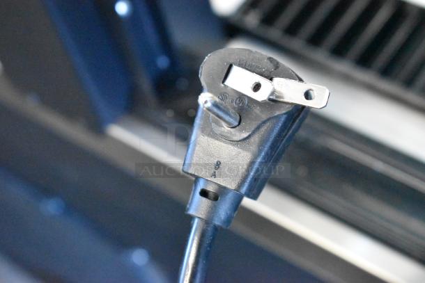 Alt text: Close-up of a power plug for the 2025 Hoshizaki AM-50BAK-AD Ice Machine, showcasing cord details.