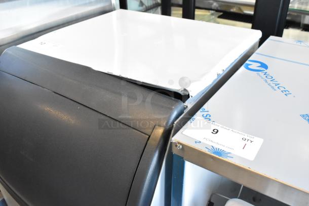 New Scotsman UN1520AX-1A stainless steel nugget ice machine, 57 lb. bin, visible top dent, 115V, 1 phase.