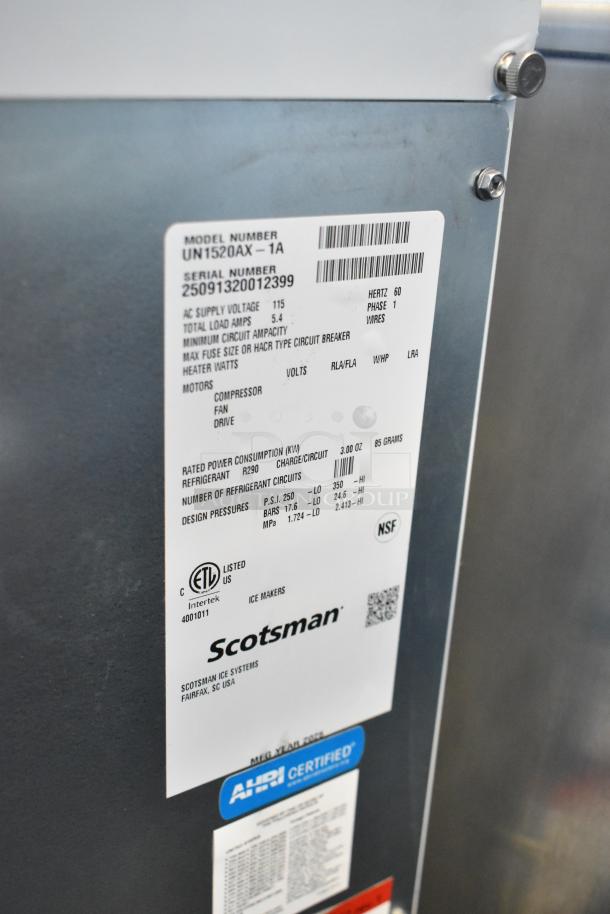 Brand new Scotsman UN1520AX-1A ice machine, stainless steel, undercounter, 57 lb. bin, 115V, 1 Phase. Tags display specs.