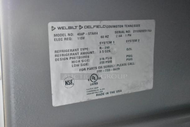 2021 Delfield 406P-STAR4 stainless steel undercounter cooler label showing model, 115V power, refrigerant type, and NSF certification.