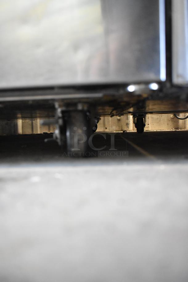 2019 Delfield 406P-STAR2 stainless steel undercounter cooler, shown on commercial casters. Used condition, 115V, single phase.