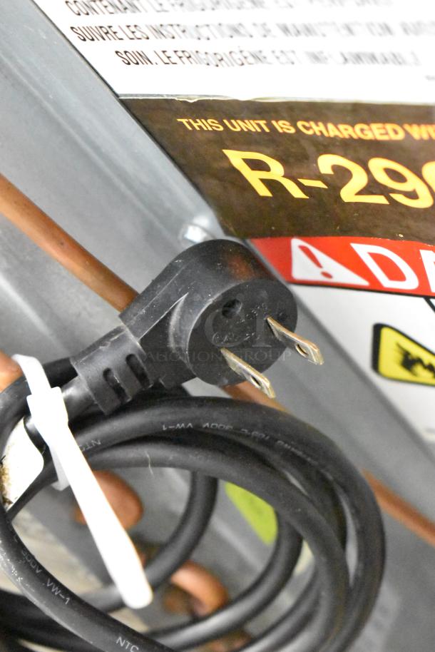 Plug and coil of the 2018 Delfield UC4048P-STAR cooler. Label indicates R-290 refrigerant. 115 Volts, 1 Phase.