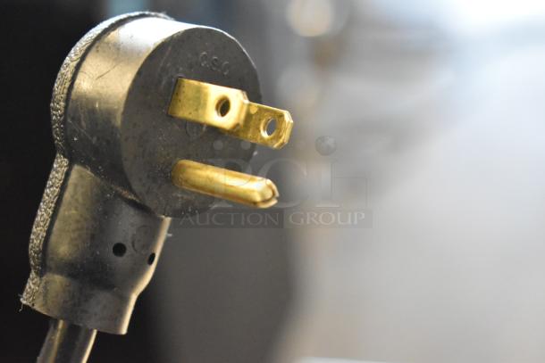 Close-up of power plug from a 2023 Delfield 406P-STAR2 single door undercounter cooler, 115V, 1 phase.