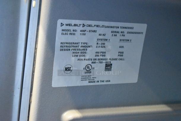2023 Delfield 406P-STAR2 stainless steel undercounter cooler on casters. 115V, 1 phase. NSF and UL listed labels visible.