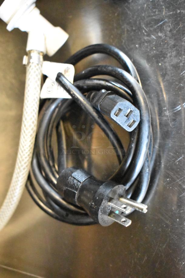 Black power cord with three-prong plug and attached hose for Automatic Bar Controls JT-NITCOM-R Nitro Dispenser.