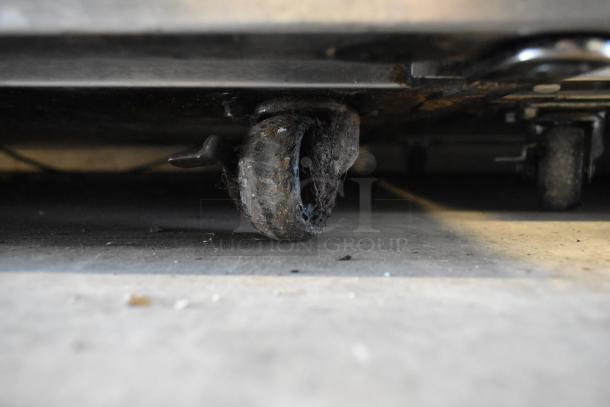 2018 Delfield stainless steel undercounter cooler caster, showing wear. Suitable for commercial use. 115 Volts, 1 Phase.