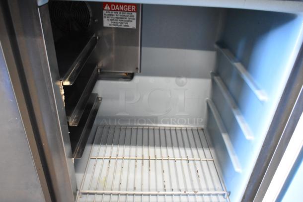2018 Delfield stainless steel undercounter cooler, 2 doors, commercial casters, 115 volts, 1 phase, labeled for safety.