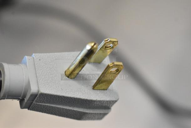 Close-up image of a 115 volts, 1 phase plug for a True TUC-27-HC undercounter cooler.