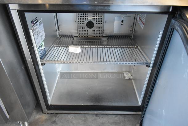 2023 True TUC-27-HC stainless steel undercounter cooler, single door, on commercial casters. 115 volts, 1 phase. Interior tags visible.