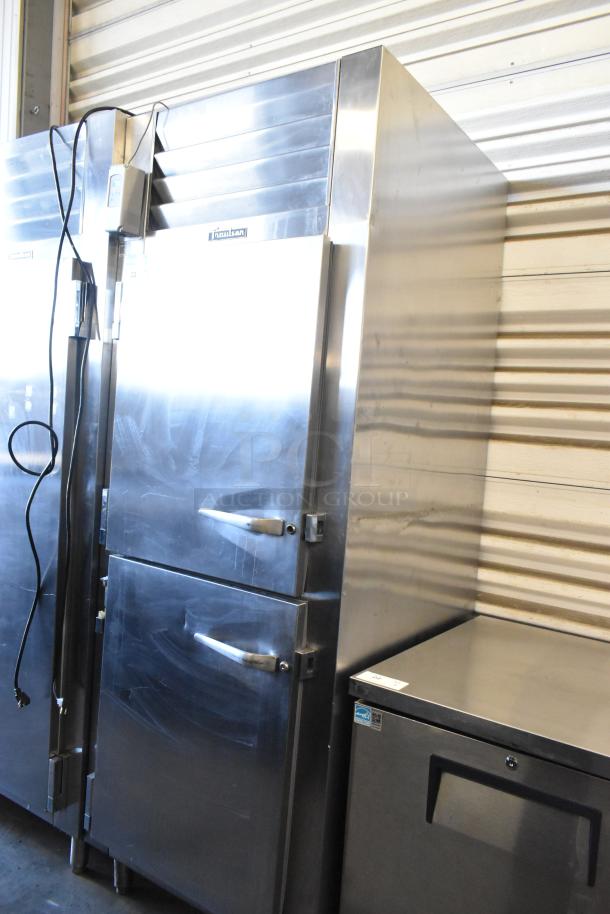 Traulsen RHT132WREHHS stainless steel reach-in cooler with two half-size doors, 115 volts, in good condition.