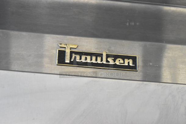 Traulsen RHT132WREHHS stainless steel reach-in cooler, 2 half-size doors, 115 volts, 1 phase, visible brand logo.