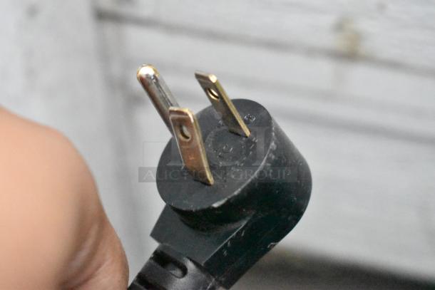 Electric plug of 2018 Delfield 406P-STAR2 undercounter cooler, 115 Volts, 1 Phase. Shows prongs and part of cable.