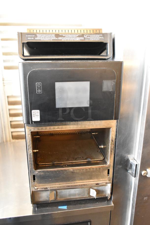 Merrychef eikon e2s metal countertop rapid cook oven, 208/240V, 1 phase; door does not stay closed.