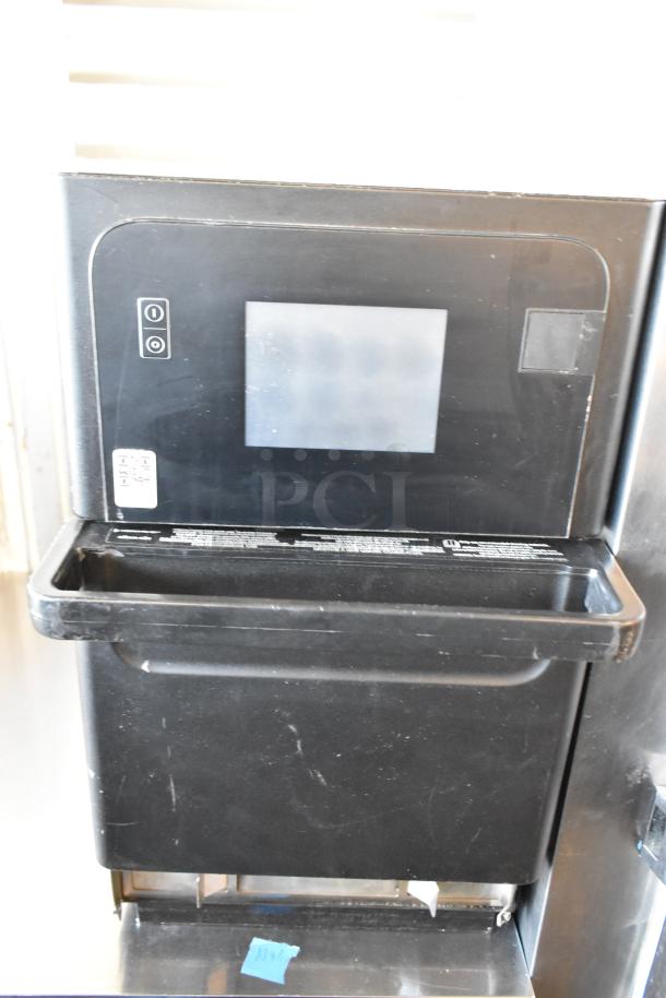 Merrychef eikon e2s electric rapid cook oven, black metal, countertop model. Door does not stay closed. 208/240V, 1 phase.