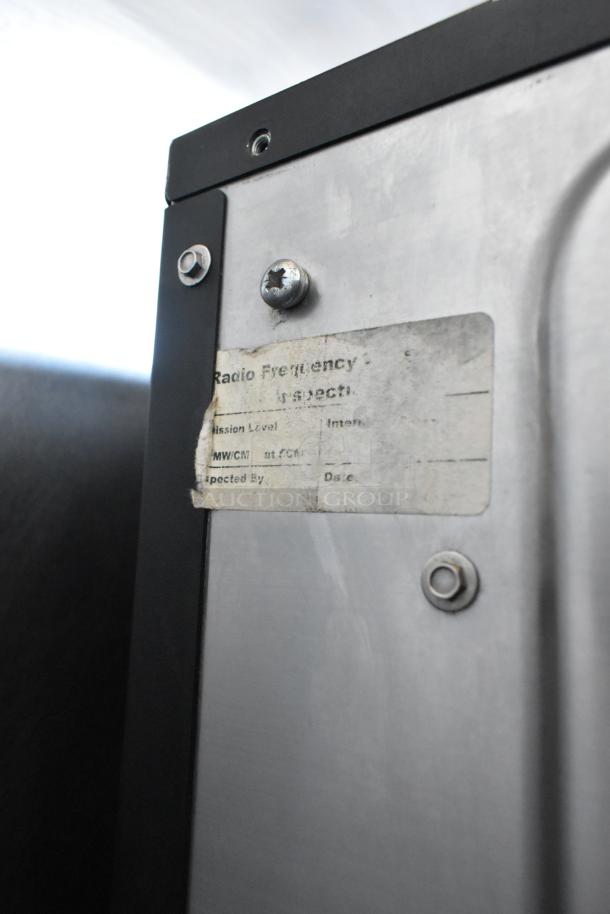 Merrychef eikon e2s rapid cook oven, metal exterior. Door issue. Visible worn inspection sticker. 208/240V, 1 phase.