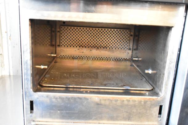 Merrychef eikon e2s rapid cook oven, countertop model. Metal exterior, door issue, 208/240V, 1 phase.