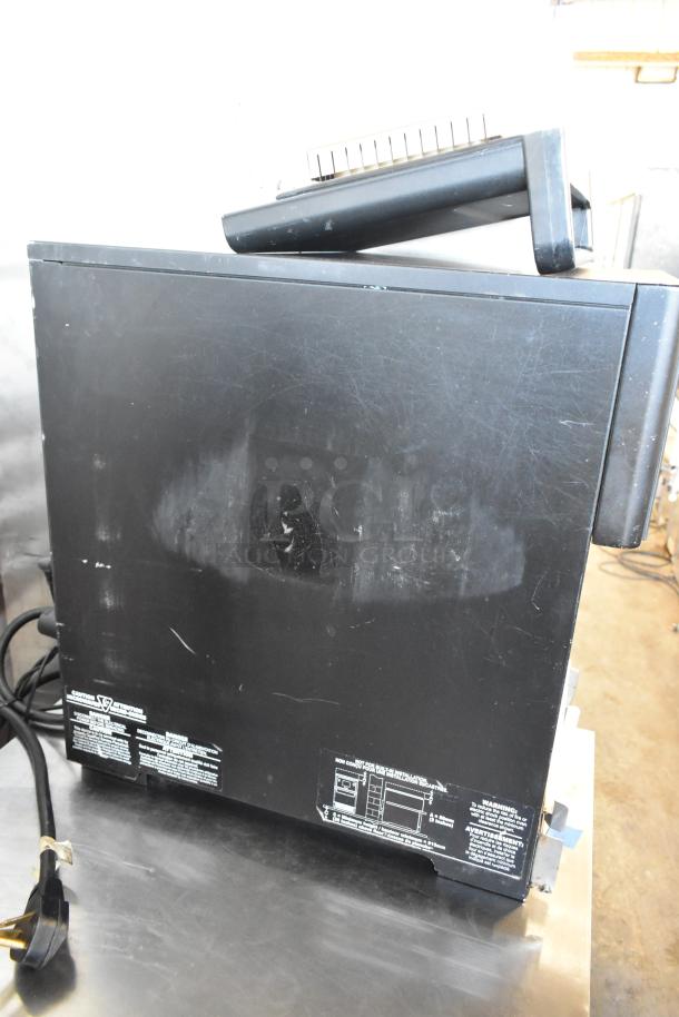 Merrychef eikon e2s rapid cook oven, metal countertop, black, door issue, 208/240V, 1 phase, visible usage marks.