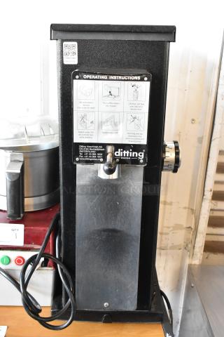 2017 Ditting KR1203 commercial coffee grinder, metal body, operating instructions visible, 120 volts, 1 phase, excellent condition.