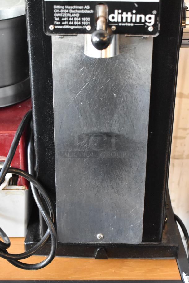 2017 Ditting KR1203 commercial coffee grinder, metal body, visible wear, 120V, 1 phase, countertop design with Ditting logo.