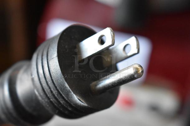 Close-up image of a three-pronged plug from the 2017 Ditting KR1203 coffee grinder. Suitable for 120 volts, 1 phase usage.