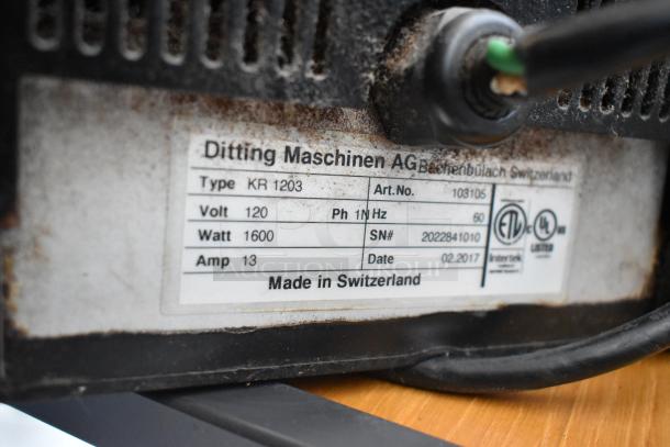 2017 Ditting KR1203 commercial coffee grinder, metal build, 120V, 1 phase, 1600W. Label shows model details and origin.