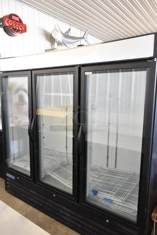 Central 69K-056 3-door reach-in cooler merchandiser with black frame, poly coated racks, 115V, 1-phase, excellent condition.