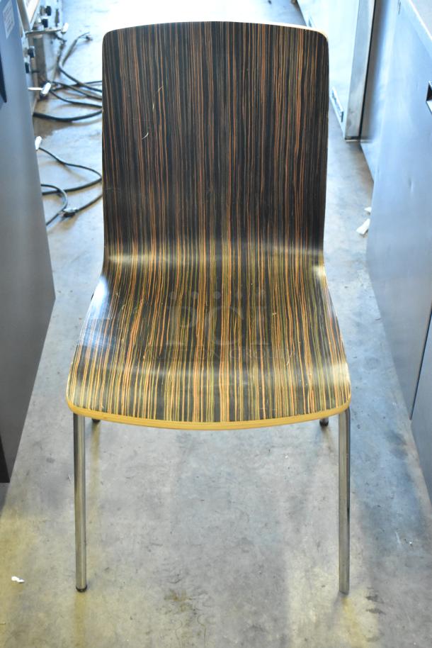 Wood pattern dining chair with metal legs, showing mild wear. Simple, modern design. Auction for set of 5 chairs.