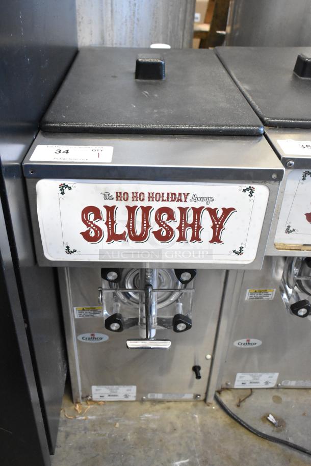 2018 Crathco 3311 stainless steel frozen beverage machine, single flavor, 115 volts, 1 phase, with "Slushy" label.