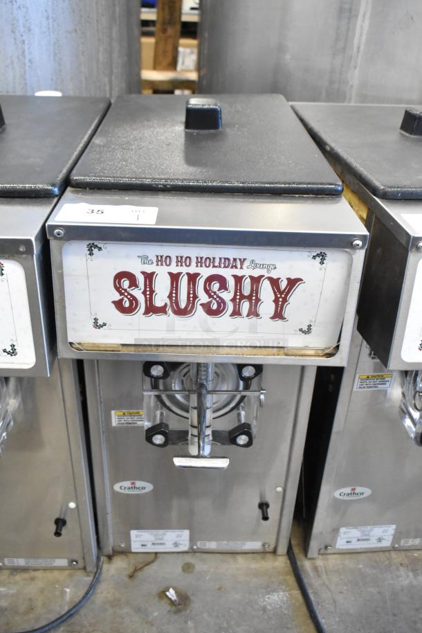 2018 Crathco 3311 stainless steel frozen beverage machine, single flavor, 115 volts, 1 phase, with "SLUSHY" label.