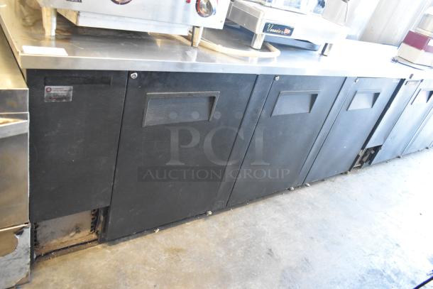 2017 True TBB-4-HC 3-Door Back Bar Cooler, metal finish, 115 volts, commercial use, visible wear on exterior.