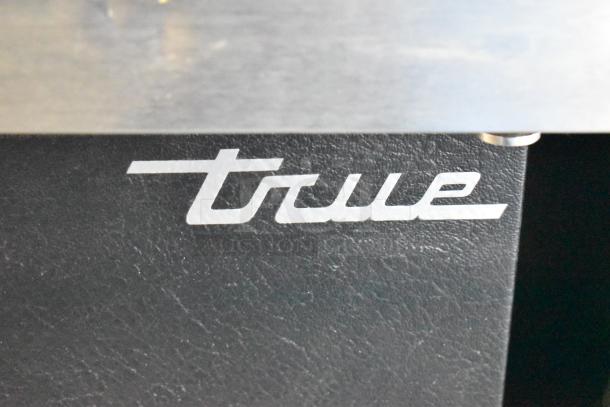 2017 True TBB-4-HC metal commercial 3-door back bar cooler, includes True logo. 115 volts, 1 phase. Excellent condition.