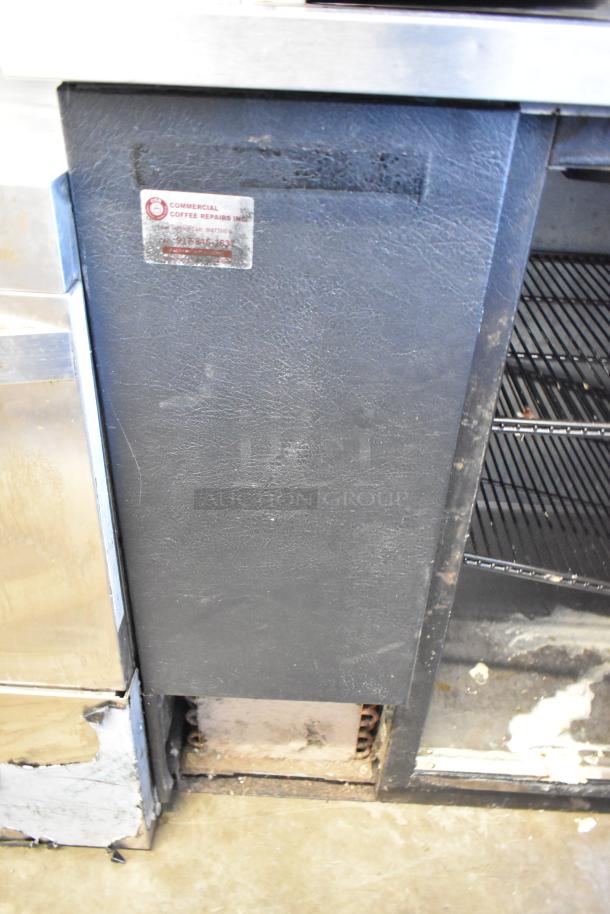 2017 True TBB-4-HC commercial 3-door back bar cooler, metal, used condition, visible wear, 115 volts, 1 phase.