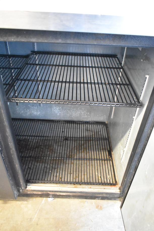 2017 True TBB-4-HC 3-door back bar cooler, metal, 115V, 1-phase. Good condition, shows interior wire shelving.