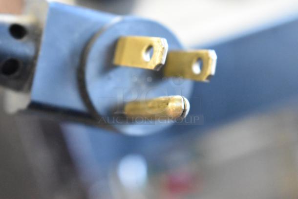 Close-up of a power plug for the 2017 True TBB-4-HC commercial back bar cooler, 115 volts, 1 phase.