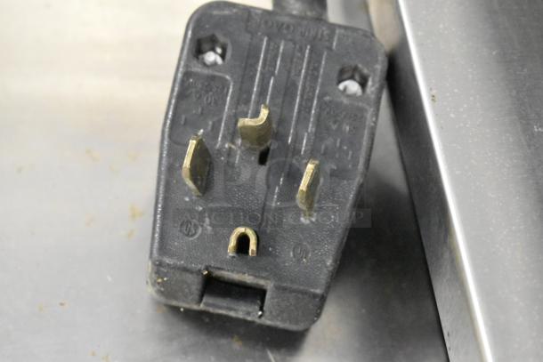 Star Max stainless steel commercial countertop electric grill plug, showing a sturdy, three-prong design.