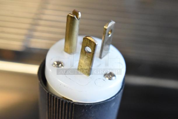 Close-up of a plug belonging to the Cecilware ESP2 Venezia 2 Group Espresso Machine, 220-240V, 1 phase.