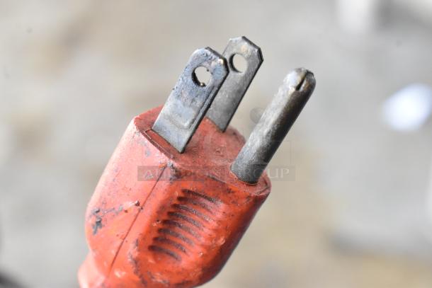 Metal countertop meat tenderizer, electric, 115 volts, 1 phase; close-up of plug showing details.